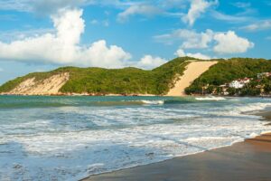 Ponta Negra beach, with Morro do Careca in the background, in the late afternoon, Natal, Rio Grande do Norte, Brazil on February 19, 2008.